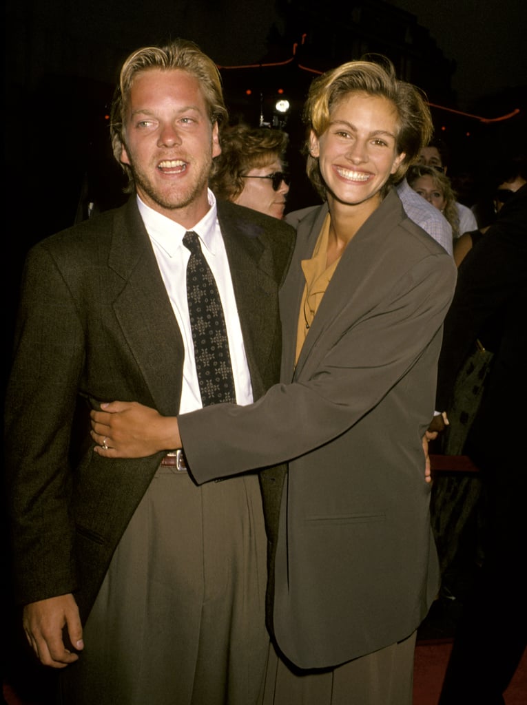 She smiled and snuggled with then-fiancé Kiefer Sutherland at the Young Guns II premiere in 1990.