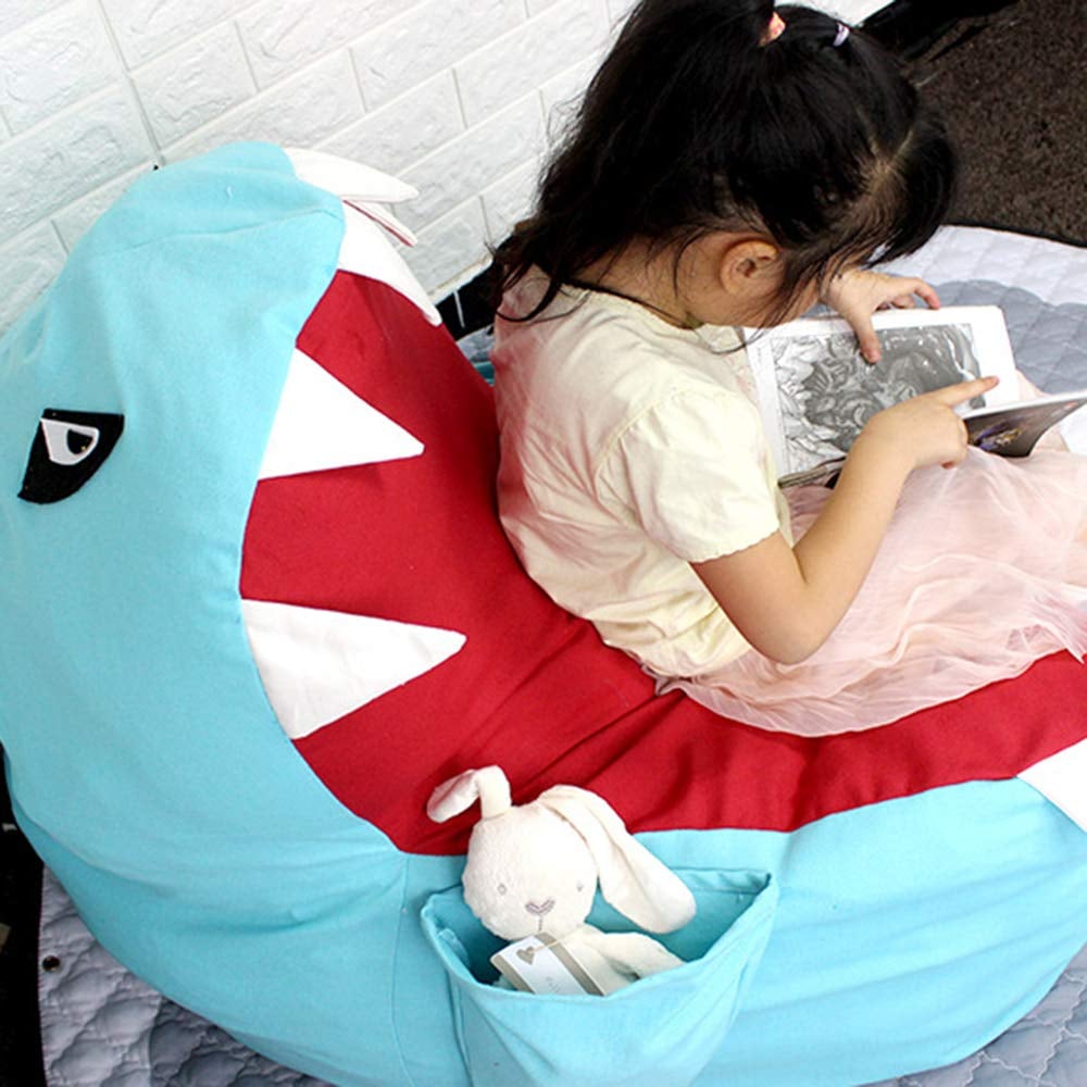 The pocket in the fin of the Lmeison Animal Storage Bean Bag Chair ($24) can hold books, toys, or even snacks!