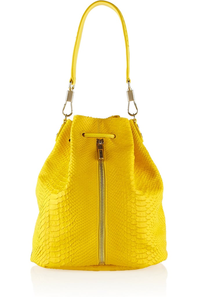 Elizabeth and James bright yellow, snake-effect Sling backpack ($645)