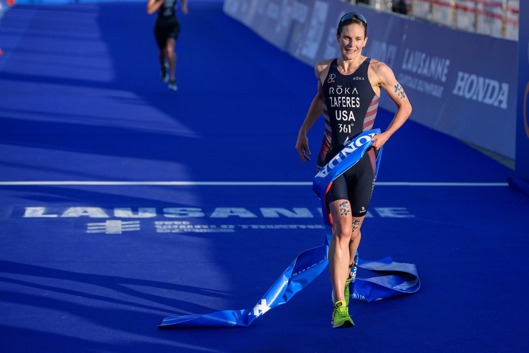 LAUSANNE, SWITZERLAND - AUGUST 31: Katie Zaferes of the United States reacts after her win during the women's elite olympic race at the ITU World Triathlon Grand Final on August 31, 2019 in Lausanne, Switzerland. (Photo by Jörg Schüler/Getty Images)