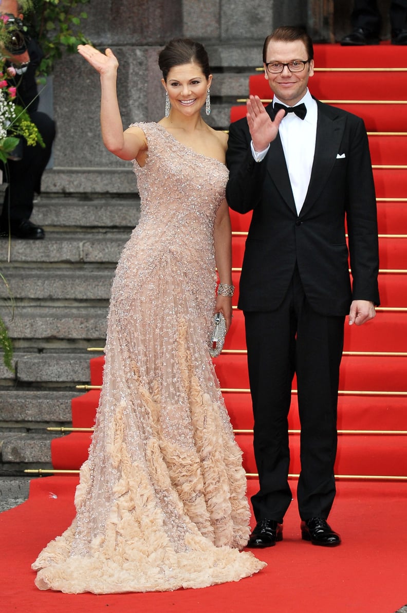 A One-Shoulder Gown With Floral Appliqué Fits Her Like a Glove