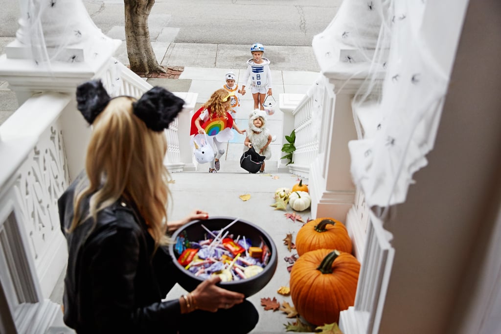 Pass out candy to trick-or-treaters.