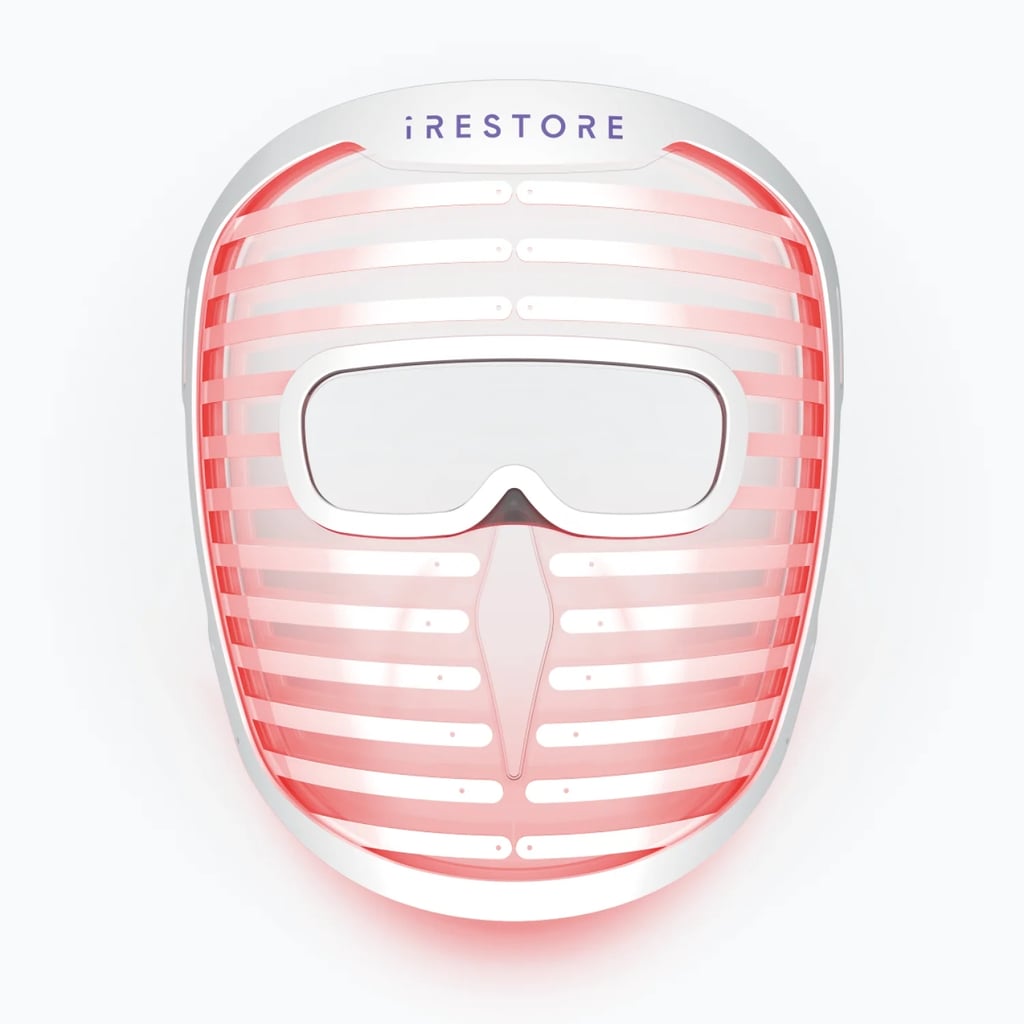 iRestore Illumina Face Mask ($399, originally $799)
If you've been holding off on splurging on a red light therapy device, iRestore's sale is the perfect opportunity. You can save up to $900 on devices and $1,550 on bundles. This LED face mask has double the amount of LEDs compared to competitor brands, offers three different wavelengths (red, infrared, and blue), includes eye and nose cut-outs for a more comfortable fit, and has a snap-on power cable and a battery that's easy to replace.