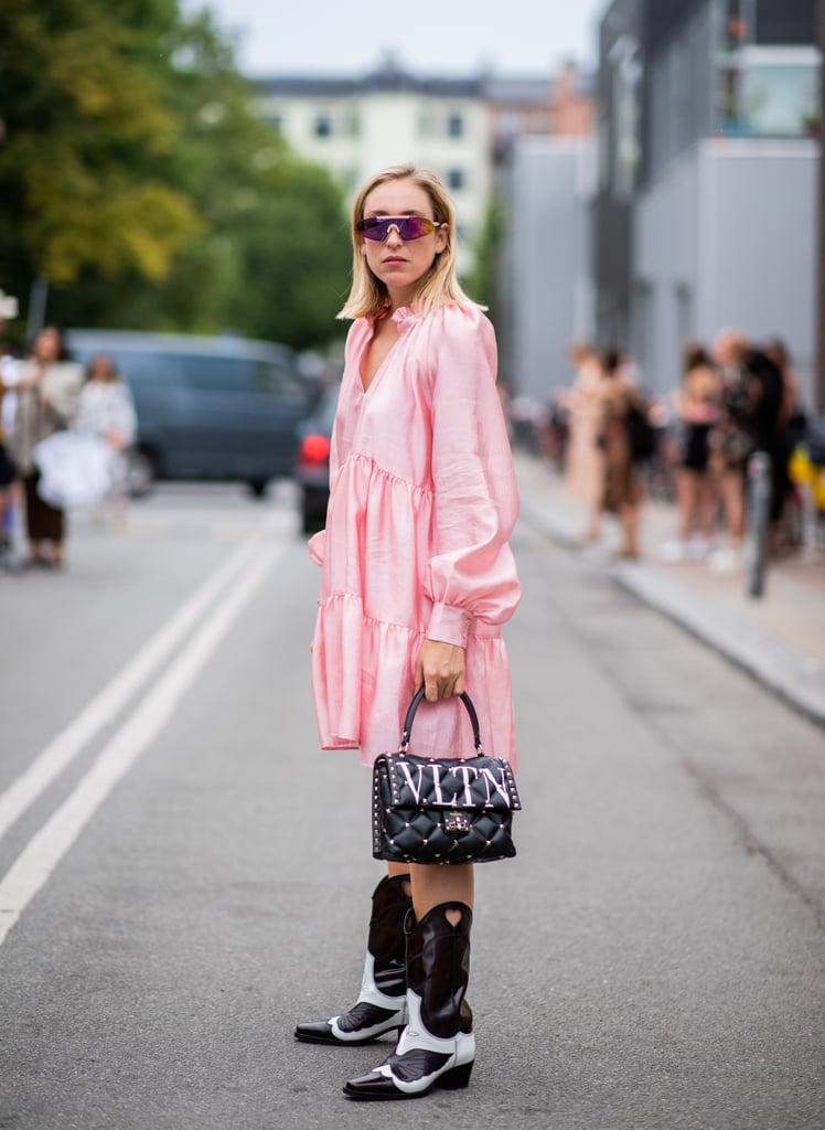 Even when you're wearing the brightest dress on the street, you can accent your boots with the help of another accessory, like a leather statement purse.