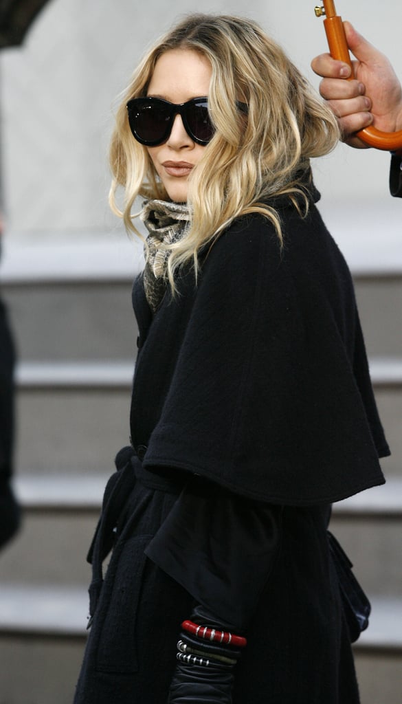 Mary-Kate attended the Fall/Winter 2010 Burberry show during LFW in a dark trench and bug-eye shades.