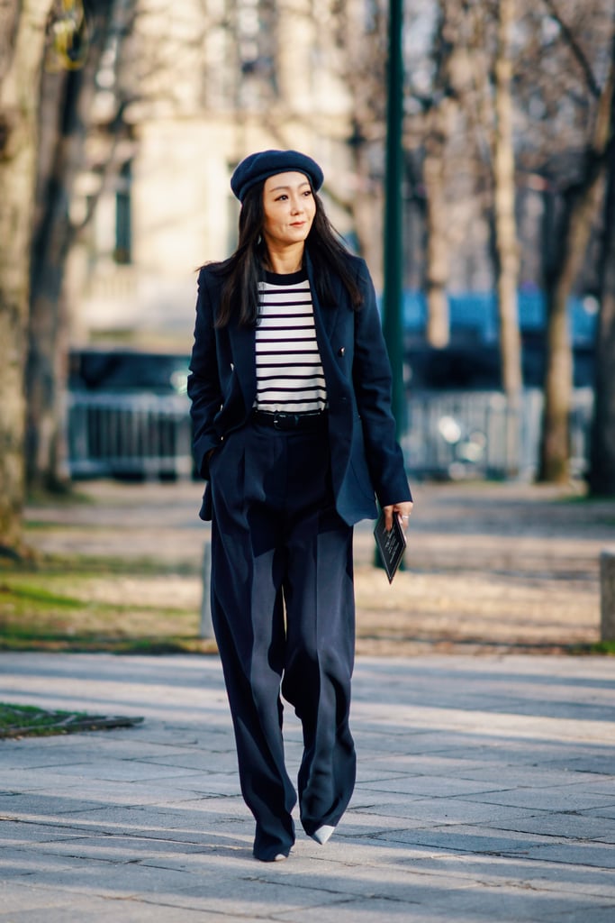 Lean into the French-girl vibe by topping off a suit and striped tee with a beret.