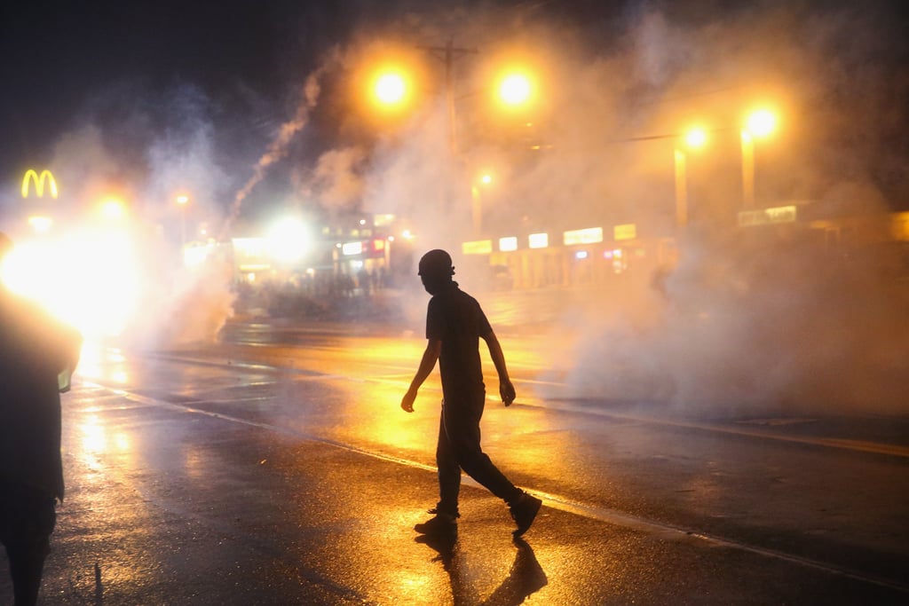 Tear gas filled the streets after demonstrators disobeyed the midnight curfew. Tear gas filled the streets after demonstrators disobeyed the midnight curfew.