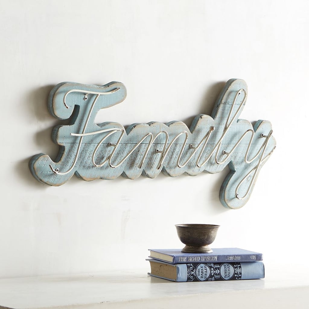 This sign is perfect to put in a dining room or living room. 
Pier 1 Imports Smoke Blue Family Wall Plaque ($40)