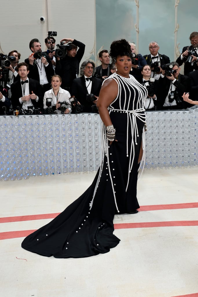Lizzo at the 2023 Met Gala Lizzo in Chanel Gown and Pearls at Met
