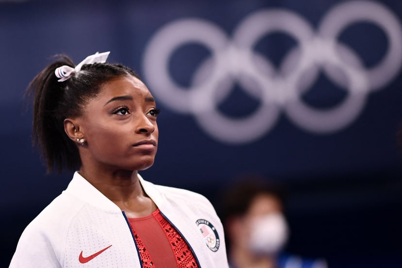 USA's Simone Biles looks on during the artistic gymnastics women's team final during the Tokyo 2020 Olympic Games at the Ariake Gymnastics Centre in Tokyo on July 27, 2021. (Photo by Loic VENANCE / AFP) (Photo by LOIC VENANCE/AFP via Getty Images)