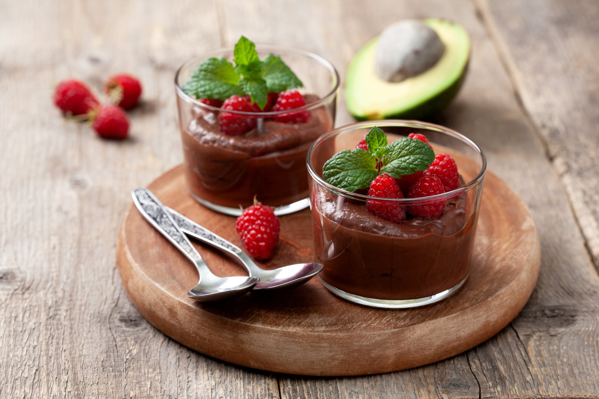 High-protein desserts in serving glasses on an old wooden background. High-protein desserts in serving glasses on an old wooden background.