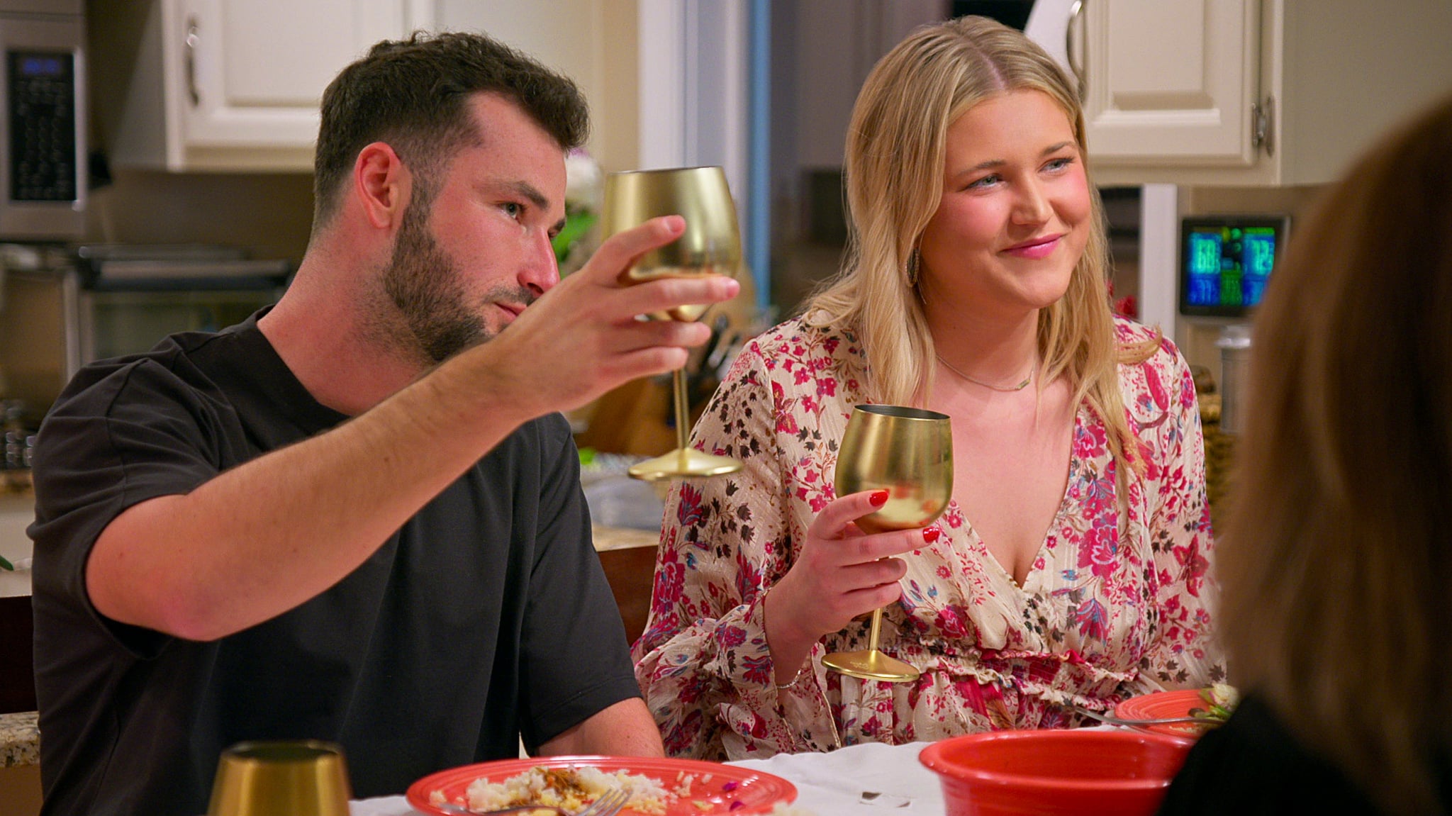 Nick Dorka and Hannah Jiles holding gold wine glasses in episode 9, season 7 of Love Is Blind