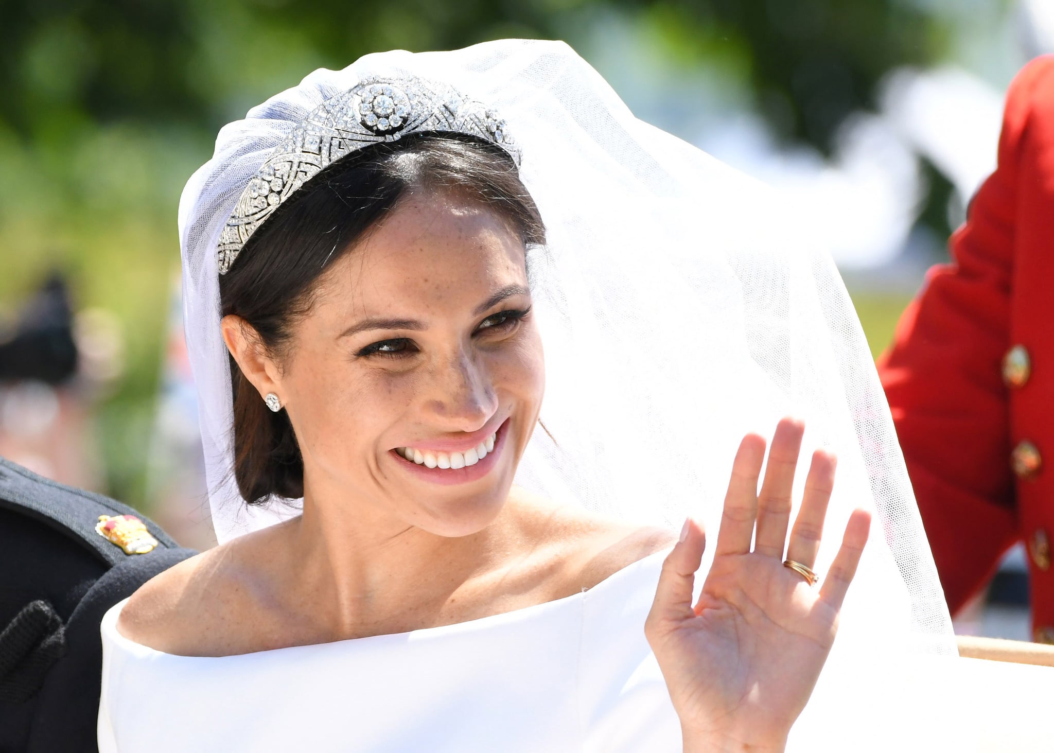 WINDSOR, ENGLAND - MAY 19:  Meghan, Duchess of Sussex leaves Windsor Castle in the Ascot Landau carriage during a procession after getting married at St Georges Chapel on May 19, 2018 in Windsor, England. Prince Henry Charles Albert David of Wales marries Ms. Meghan Markle in a service at St George's Chapel inside the grounds of Windsor Castle. Among the guests were 2200 members of the public, the royal family and Ms. Markle's mother, Doria Ragland.  (Photo by Karwai Tang/WireImage)