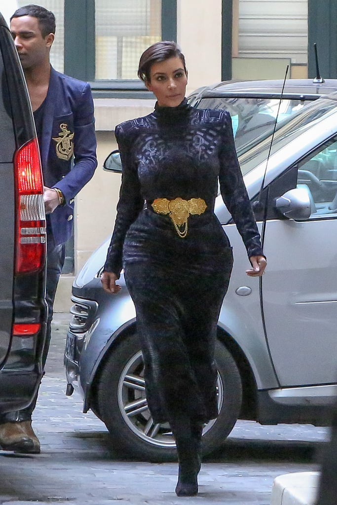 While Kim tends to go for skin-baring looks, she covered up in a velvet turtleneck dress while arriving at the Balmain office in Paris in 2014.
