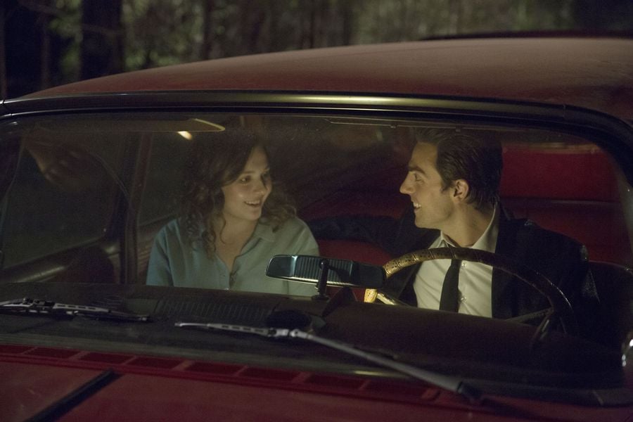 Finally, here she is in a car with Johnny.