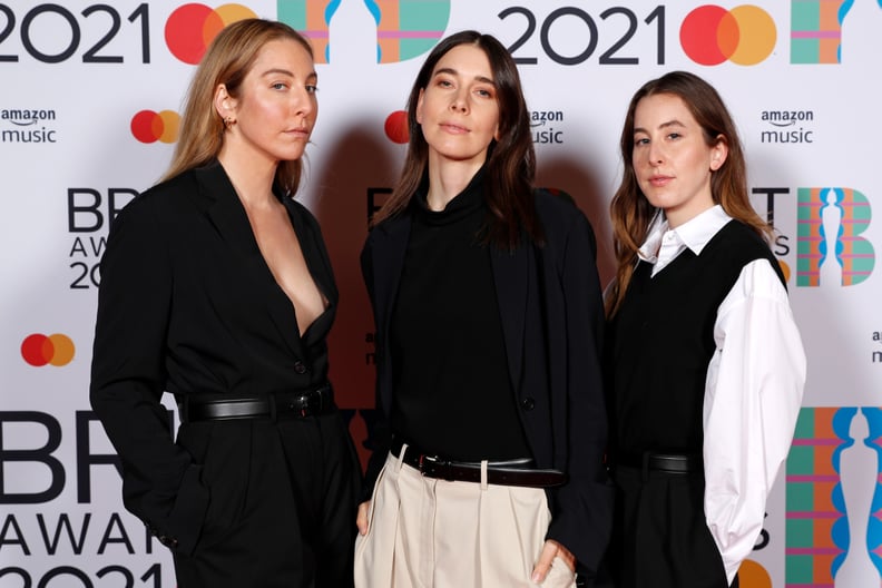 LONDON, ENGLAND - MAY 11: (L-R) Este Haim, Danielle Haim,and Alana Haim of Haim pose in the media room during The BRIT Awards 2021 at The O2 Arena on May 11, 2021 in London, England. (Photo by JMEnternational/JMEnternational for BRIT Awards/Getty Images)