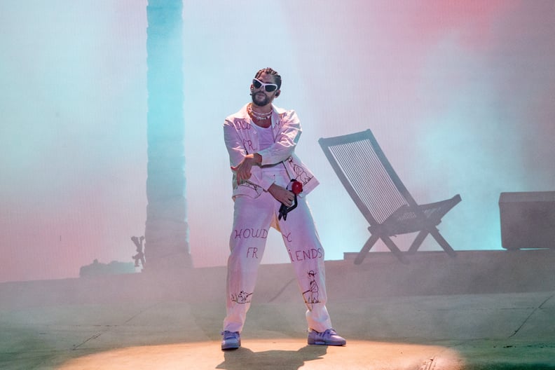 Entertainer Bad Bunny, right, attends during the first half of an