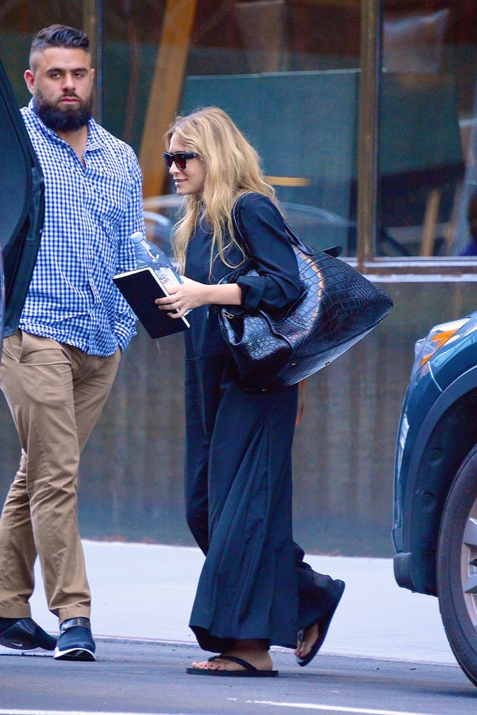 Ashley Olsen in Black Flip-Flops and Maxi Dress July 2018