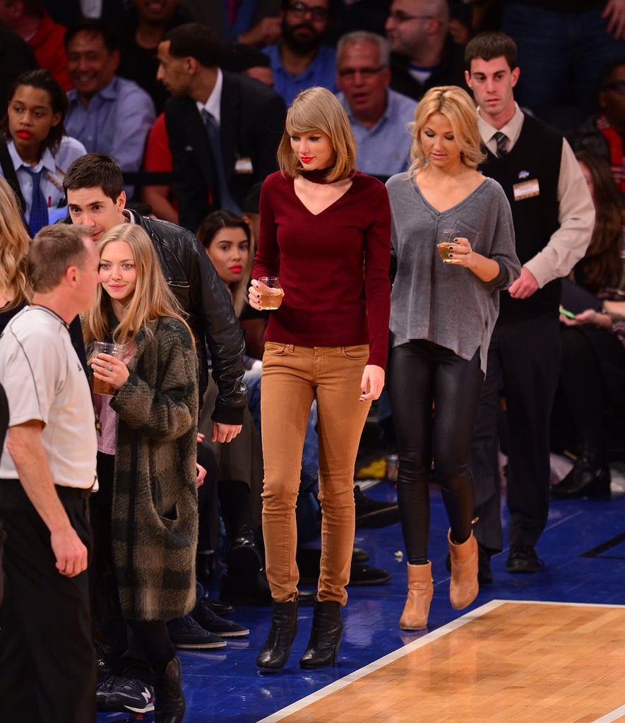 Taylor Wore the 525 America Sweater to a Basketball Game in November