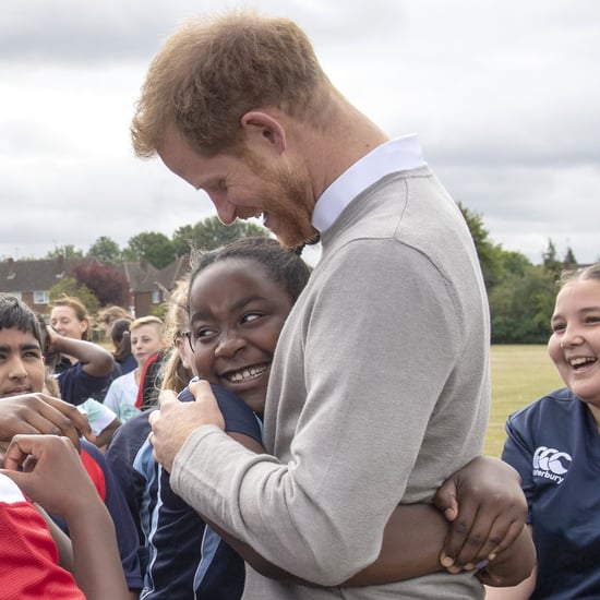 Prince Harry Hugs Kids at Lealands High School