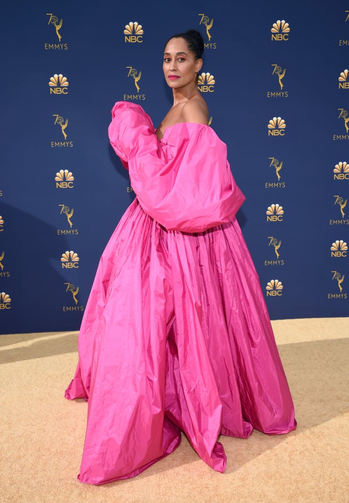OK, Tracee Ellis Ross just had a moment at the 2018 Emmys. The Black-ish star wowed the crowds in a fuchsia dress that was made to be stared at. Tracee's Valentino Haute Couture gown not only came in a striking pink hue, but it also featured poufy sleeves and a full skirt. For another layer of drama, the actress pulled her hair into a high bun and matched her eye shadow to her dress. She accessorized with Tamara Mellon heels, Repossi jewels, and an Edie Parker clutch. Read on to see all angles of her stunning gown. 

    Related:

            
            
                                    
                            

            Kristen Bell Looks Like an Angel in White — and You Can Buy Her Exact Dress Now