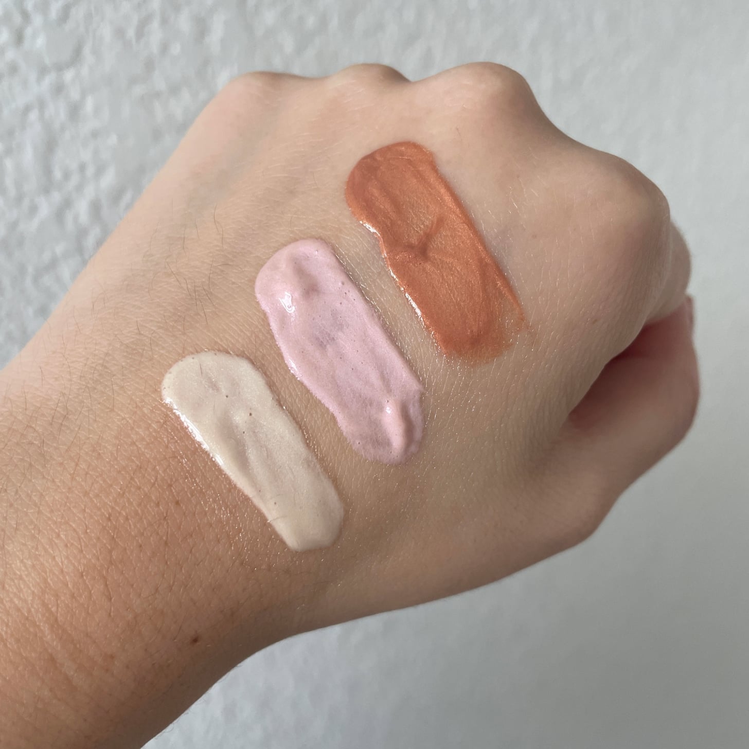 Let Me Glow Serum Shades Swatched on the Back of a Hand Let Me Glow Serum Shades Swatched on the Back of a Hand