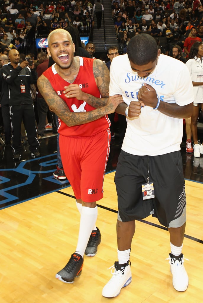 Chris Brown joked around with Kyrie Irving during the game.