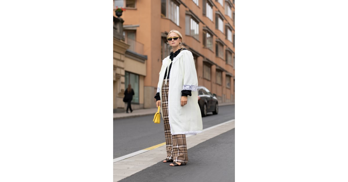 Pare down bold plaid pants with a clean white overcoat. How to Wear Plaid 2018 POPSUGAR