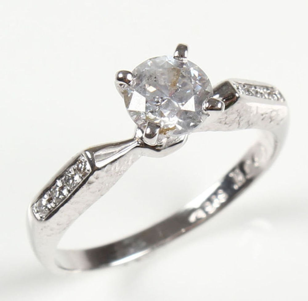 Sparkle in this elegant solitaire ring ($965) with accents.