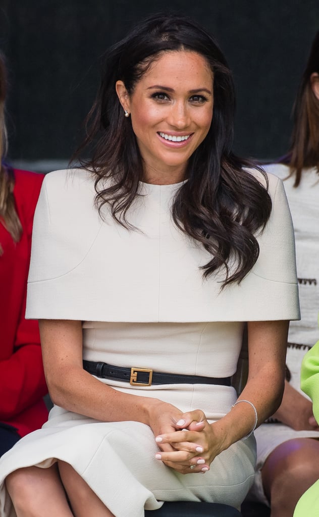 When her Givenchy cape dress deserved the spotlight on her first official engagement with Queen Elizabeth, Meghan opted for very simple, classic pearl earrings that did not distract.