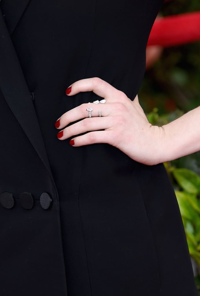Emma Stone's Repossi rings were as unique as the train on her Dior Haute Couture design. The star showed us the perfect example of a marriage between jewelry and a dress.