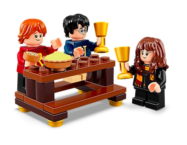 Harry, Hermione, and Ron at the Gryffindor Great Hall Table