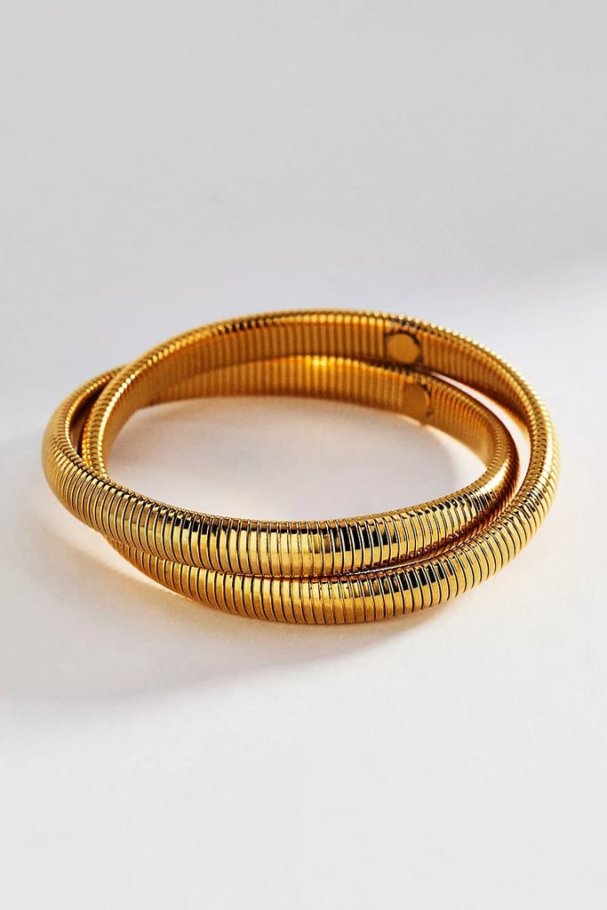 By Anthropologie Textured Metal Bracelet ($44)
Looking to add something new to your wrist stack? This bracelet, available in silver and gold, adds movement and texture thanks to the fluid design.