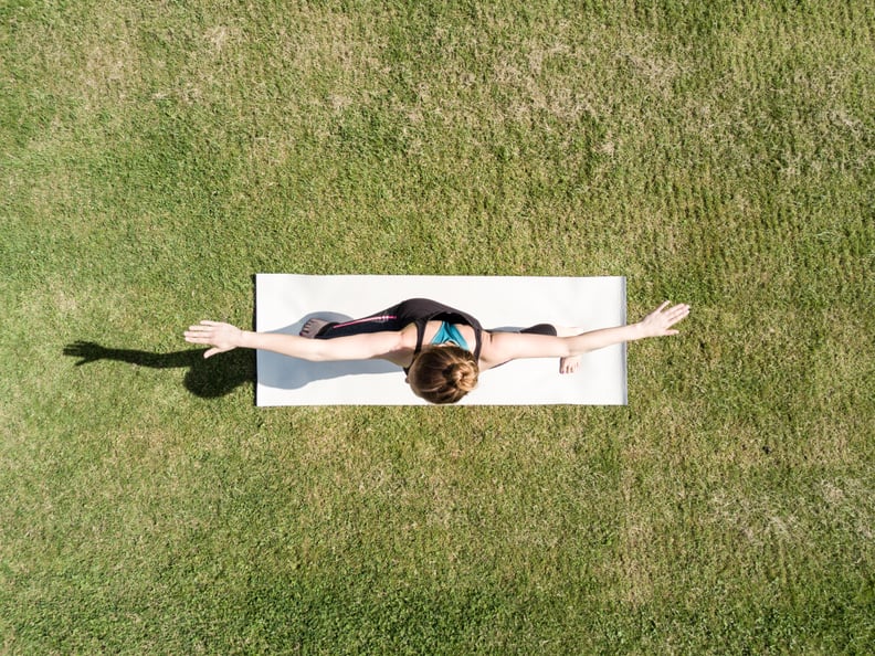 Young woman performing yoga in a park