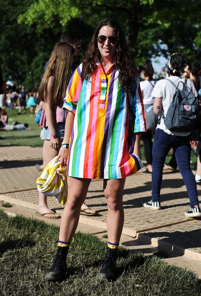 A vibrant vintage rainbow-striped top got a festival refresh with comfortable boots and aviators.