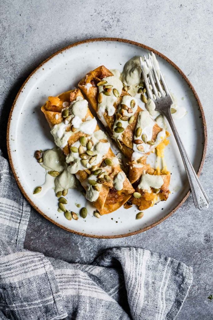 Cheesy Pumpkin Taquitos With Roasted Jalapeño Pepita Crema