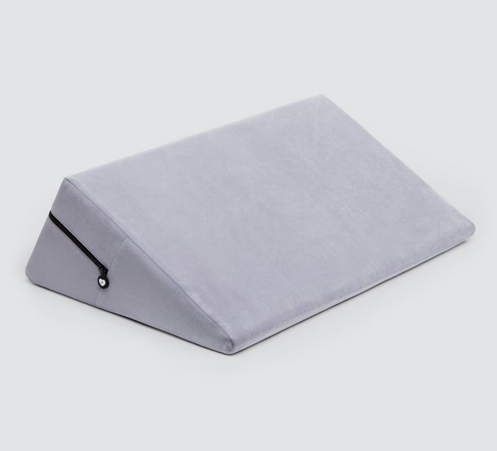 Lovehoney Elevate Sex Position Enhancer Wedge ($80, originally $100)
This velvety-soft wedge pillow can position you to get all the right angles. It's ideal if you're exploring kink, crave more comfort, or have limited mobility.