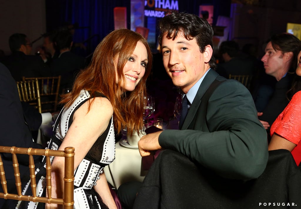 Julianne sat next to Miles Teller.