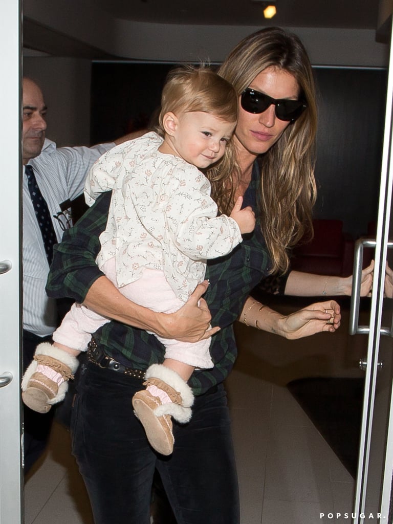 Gisele held smiley Vivian before they caught a flight at LAX on Sunday.