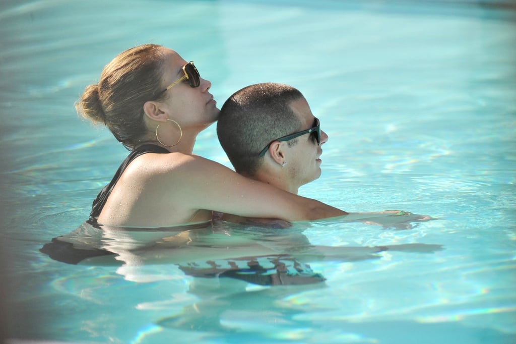 Jennifer Lopez held on to boyfriend Casper Smart as they relaxed in the pool in Miami in September 2012.