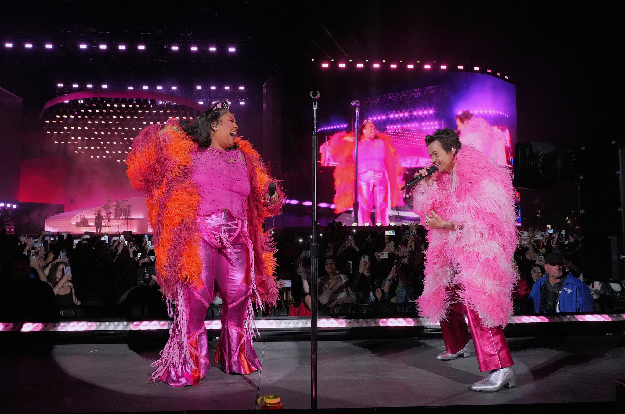 INDIO, CALIFORNIA - APRIL 22: (L-R) Lizzo and Harry Styles perform on the Coachella stage during the 2022 Coachella Valley Music And Arts Festival on April 22, 2022 in Indio, California. (Photo by Kevin Mazur/Getty Images for Harry Styles)