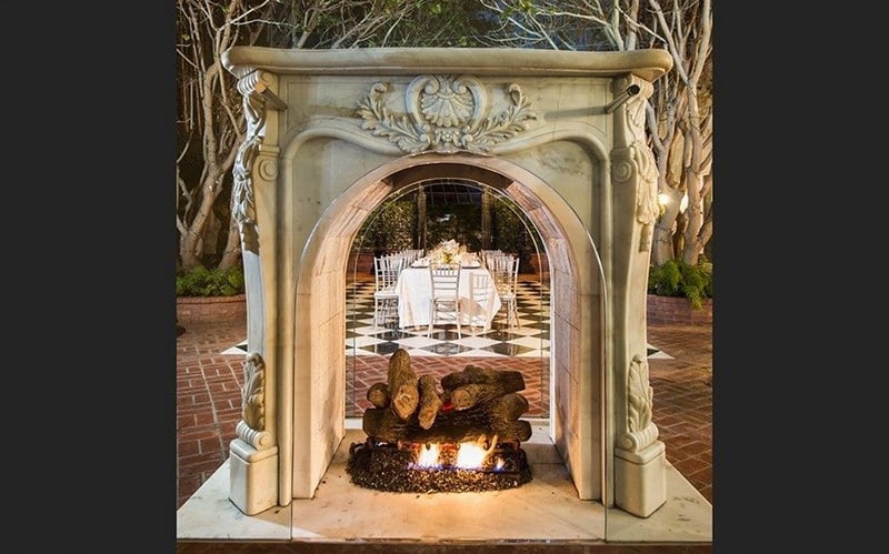 A Freestanding Outdoor Fireplace Adds Elegance And Whimsy To The