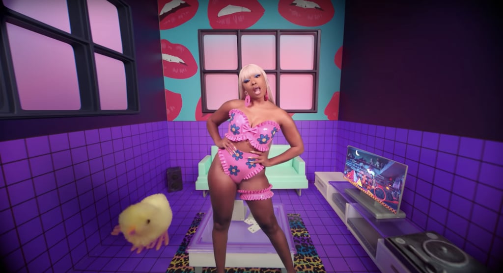 Megan later rocked another stylish PVC look. This pink custom Venus Prototype outfit was designed with purple flowers and styled with a matching garter.