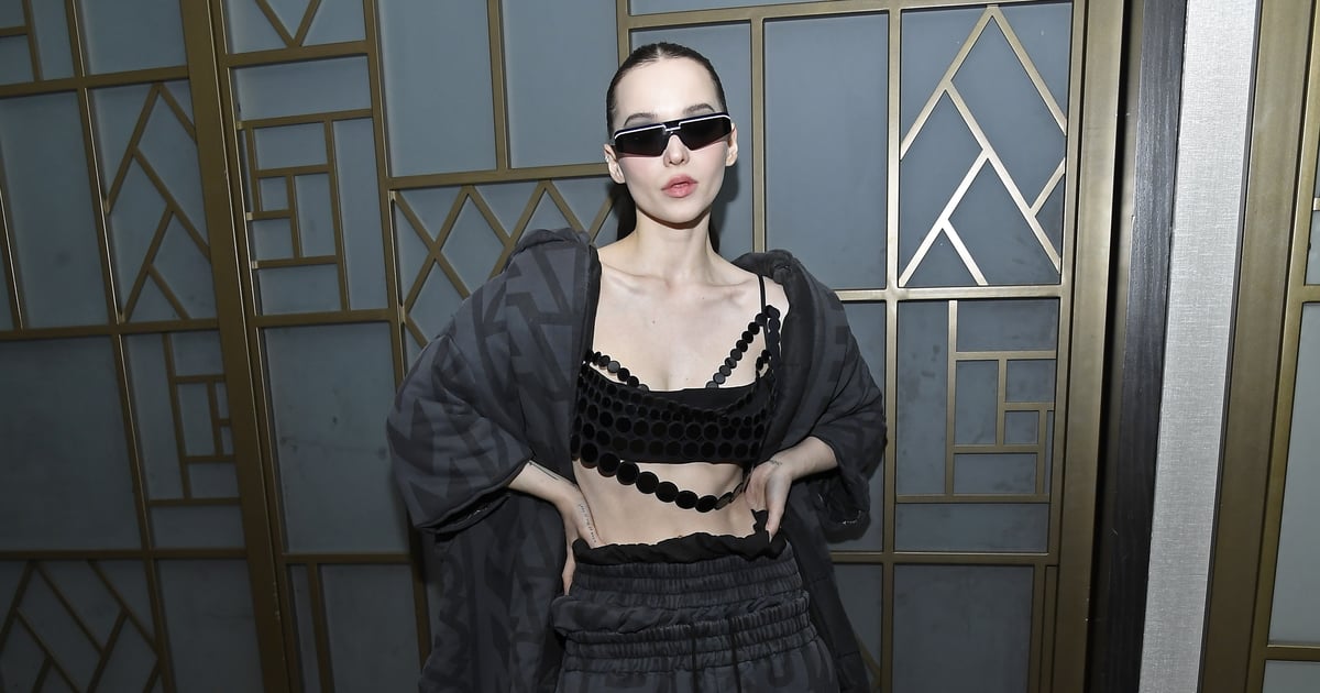 Dove Cameron Nails Dark Glamour in a Black Bra Top and Matrix-Style Sunglasses.jpg