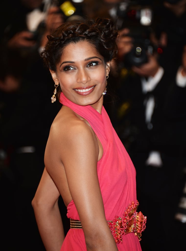 Freida Pinto wore a bevy of braids in her hair to create a striking woven updo at the Great Gatsby premiere. Freida Pinto wore a bevy of braids in her hair to create a striking woven updo at the Great Gatsby premiere.