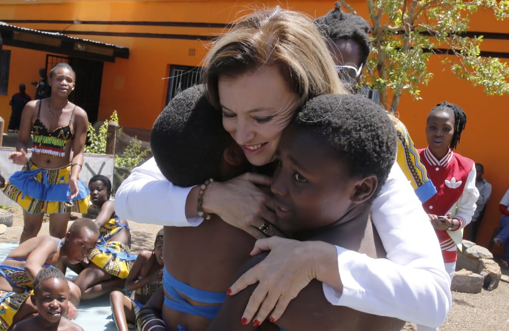 She hugged locals while on a visit to Soweto.