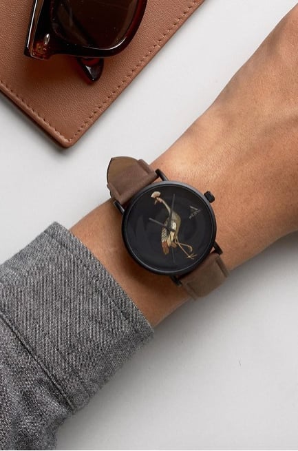 The ASOS Watch With Tan Faux Leather Strap And Bird Design ($29) is perfect for the dude who loves all things nature.