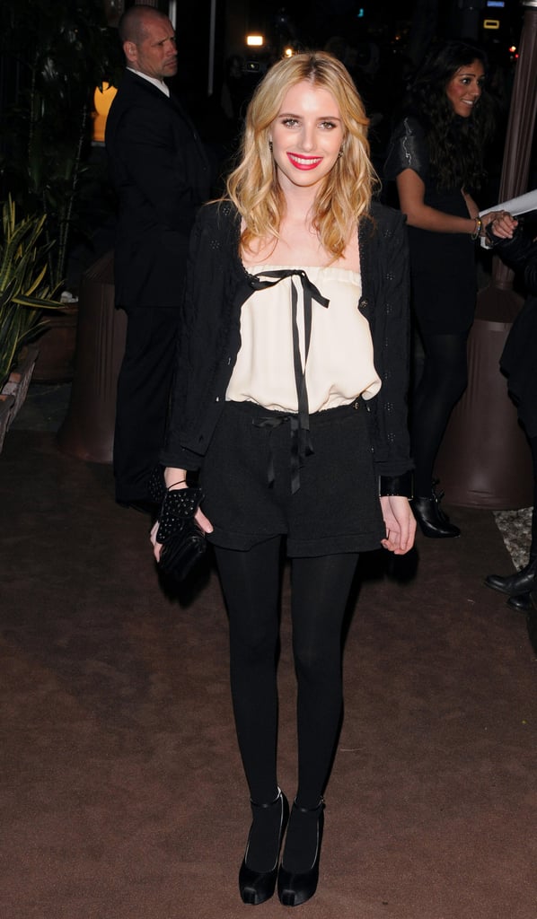 Emma punched up her menswear-inspired Chanel style with a red lip for an LA event in 2011.