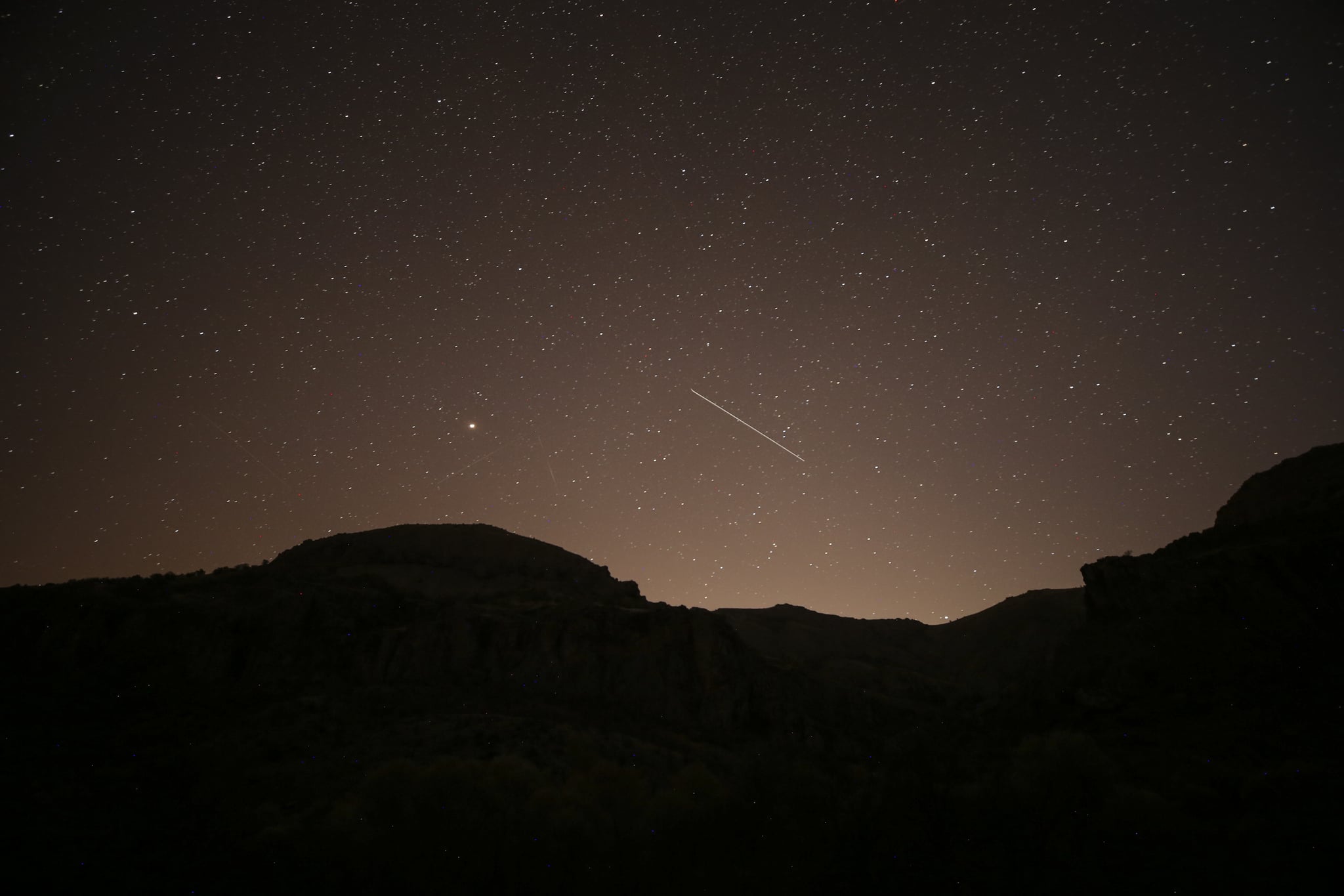 A Leonid meteor shower streaked across the dark night sky over Ankara, Turkey, in November 2020. The meteor shower in November will peak around the 18th of the month this year.