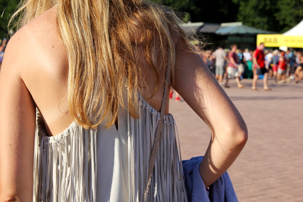 The all-over fringe around the neckline of this dress created an amazing effect as this attendee walked to the next show.